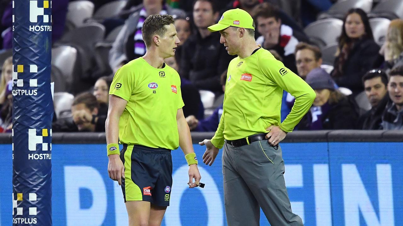 MELBOURNE, AUSTRALIA - AUGUST 11: Umpires review a score during the round 21 AFL match between the St Kilda Saints and the Fremantle Dockers at Marvel Stadium on August 11, 2019 in Melbourne, Australia. (Photo by Quinn Rooney/Getty Images)