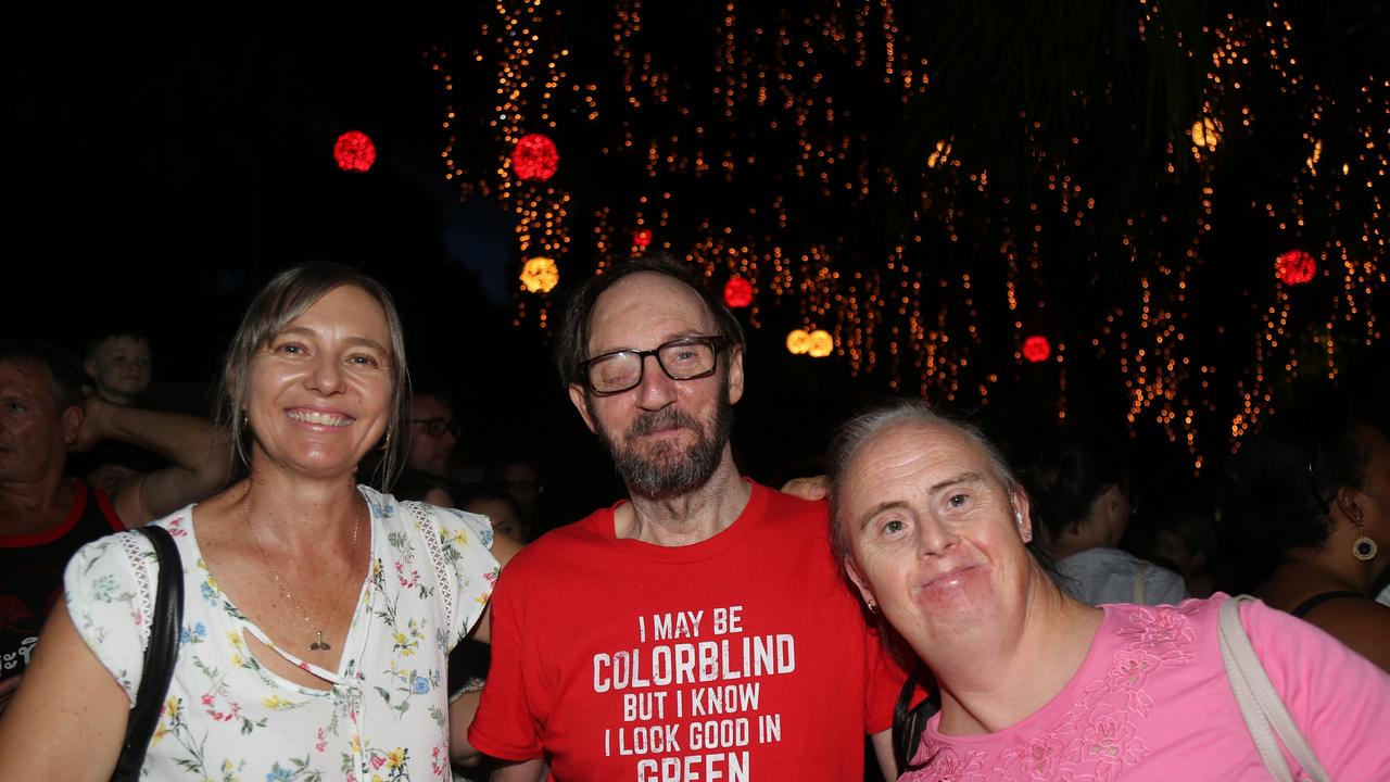 Sam Cook, Robert Canet and Trinity Belnap celebrate the last night of Chinese New Year festivities in Cairns. Picture: Kate Stephenson