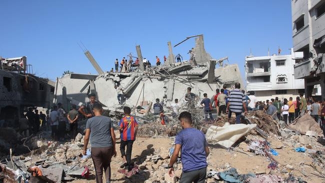 Palestinians search in the rubble for survivors at the site of an Israeli strike in the Shejaiya suburb east of Gaza City on September 12. Picture: AFP