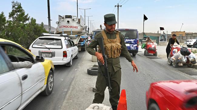 An Afghan policeman stands guard at a checkpoint along the road in Kabul. Picture: AFP