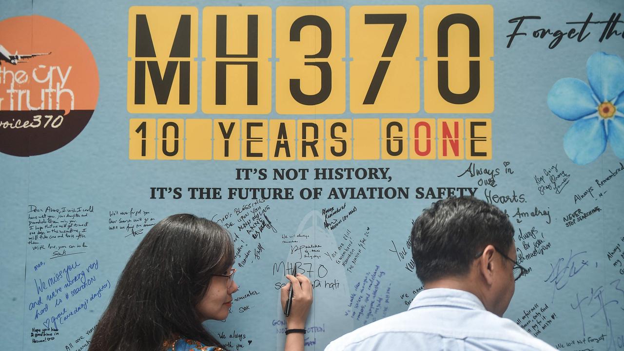 A woman writes a message during an event held by relatives of the passengers and supporters to mark the 10th year since the Malaysia Airlines flight MH370 carrying 239 people disappeared from radar screens on March 8, 2014 while en route from Kuala Lumpur to Beijing, in Subang Jaya on March 3, 2024. (Photo by Arif Kartono / AFP)<a capiid="fcee6fe2b1b4fd0b39f20b9ccc50d117" class="capi-video">The search for missing Malaysia Airlines flight MH370 may soon resume with the Malaysian government in negotiating a new deal with a US technology firm.</a>