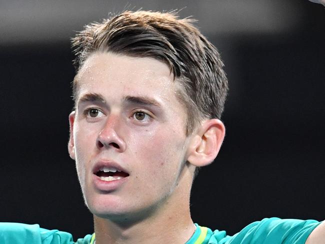 Alex de Minaur of Australia celebrates winning his first round match against Steve Johnson of the USA at the Brisbane International Tennis Tournament in Brisbane, Sunday, December 31, 2017. (AAP Image/Darren England) NO ARCHIVING, EDITORIAL USE ONLY