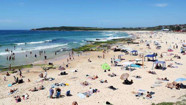 Swimmers keeping their distance at Maroubra Beach. Picture: Tim Hunter