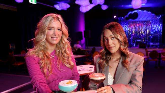 Jennifer Sacks and Jamie Wise pictured with cocktails at the D. L. M pop up bar Barangaroo. Picture: Damian Shaw