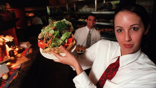 Waitress Anna Bereen with a plate of food at The Keg Restaurant in 1997.