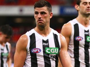 SYDNEY, AUSTRALIA - MAY 13:  Scott Pendlebury captain of the Magpies leads his team his team from the field after the round eight AFL match between the Greater Western Sydney Giants and the Collingwood Magpies at Spotless Stadium on May 13, 2017 in Sydney, Australia.  (Photo by Matt King/Getty Images)