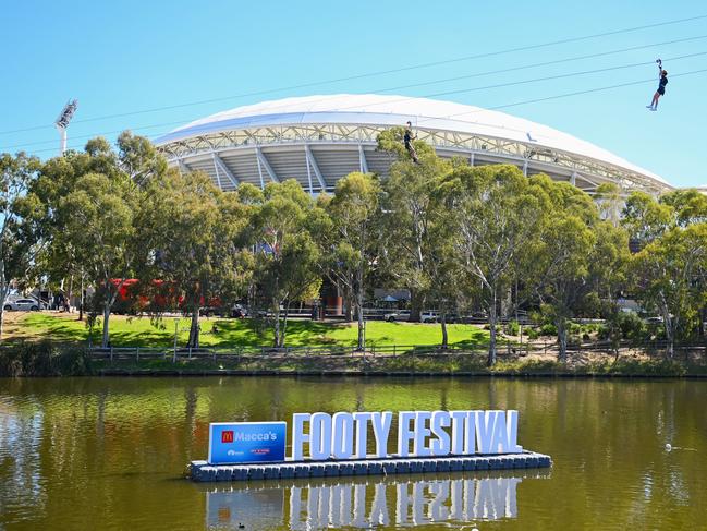 ADELAIDE, AUSTRALIA - APRIL 05: A general view of the Gather Round Footy Festival signage in front of Adelaide Oval at Elder Park on April 05, 2024 in Adelaide, Australia. (Photo by Morgan Hancock/AFL Photos/via Getty Images)