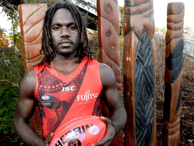 Anthony McDonald-Tipungwuti unveils Essendon’s Dreamtime guernsey at the club’s Tullamarine base. Picture: Mark Wilson