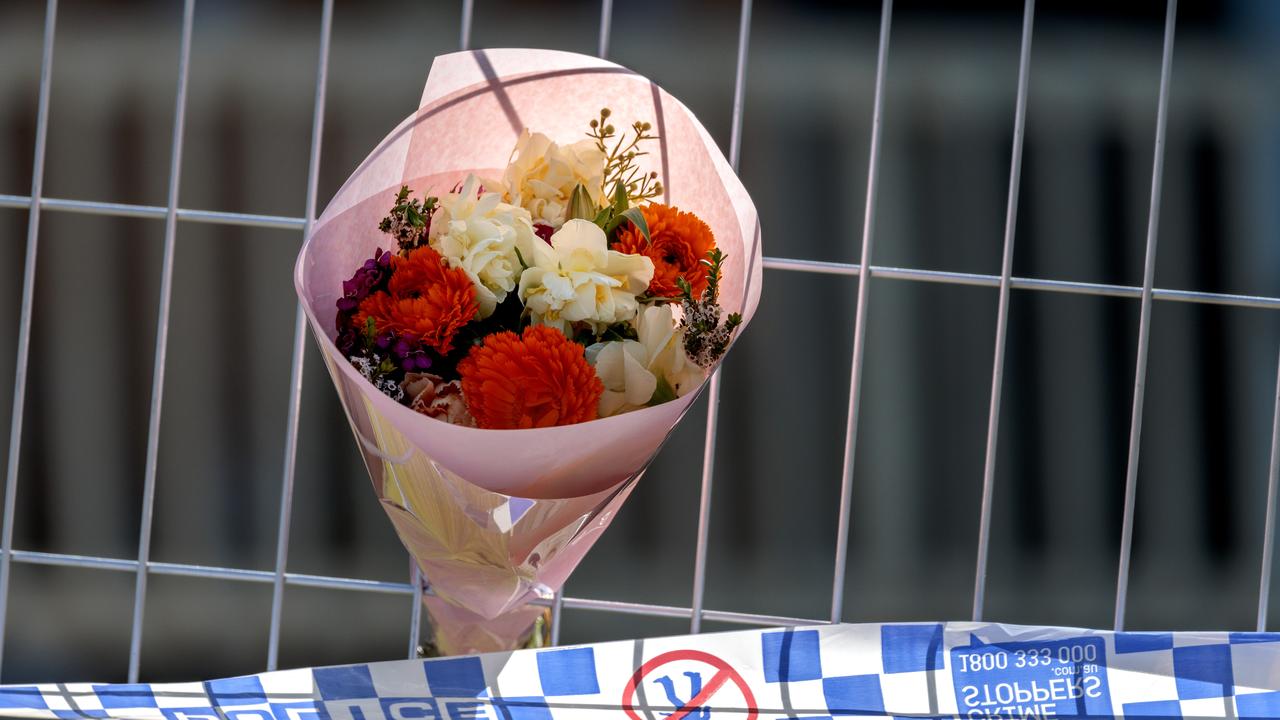 Flowers left at the scene of a fatal house fire. Picture: David Geraghty