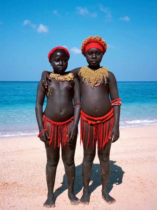 Two Jarawas girls, wearing traditional clothes, on the beach on the edge of the island where the Jarawas live. Picture: Thierry Falise/LightRocket via Getty Images