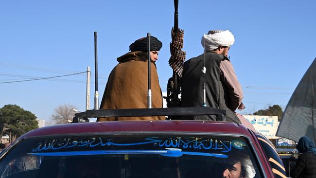 Taliban fighters sit on a vehicle along a road in the Herat. Picture: AFP.