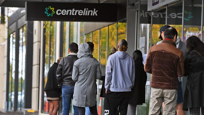 People queue up outside a Centrelink office in Melbourne in April 20. Picture: AFP