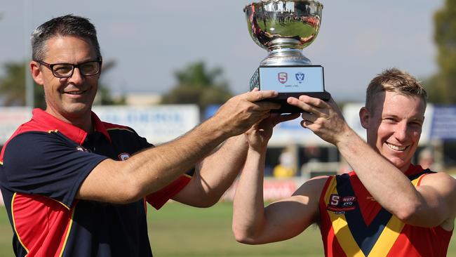 Jade Rawlings (left) celebrates the SANFL state side’s win against the VFL this year with captain Joseph Sinor. Picture: David Mariuz/SANFL