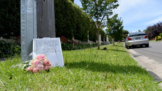 Flowers left at the scene where Dr Ash Gordon died on Eildon St, Doncaster. Picture: Andrew Henshaw