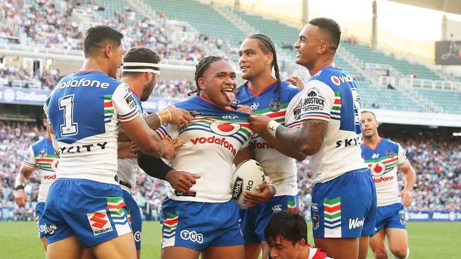 Solomone Kata and the Warriors celebrate a try against the Warriors.