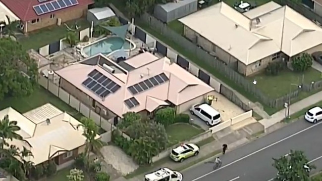 Queensland Ambulance Service cars can be seen out the front of the address on March 25. Picture: 9 News Queensland