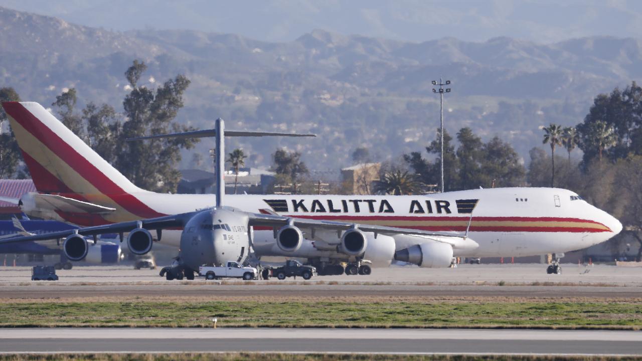 An aeroplane carrying US citizens being evacuated from Wuhan, China, lands at March Air Reserve Base in Riverside, California. One of the 195 Americans evacuated from the virus outbreak zone in China and housed at a California military base for three days of monitoring tried to leave the base and was placed under quarantine. Picture: /Ringo H.W. Chiu