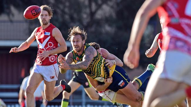 14/07/18 - SANFL: North Adelaide v Eagles at Prospect Oval.  Eagle Scott Lewis gets a handpass away.Picture: Tom Huntley