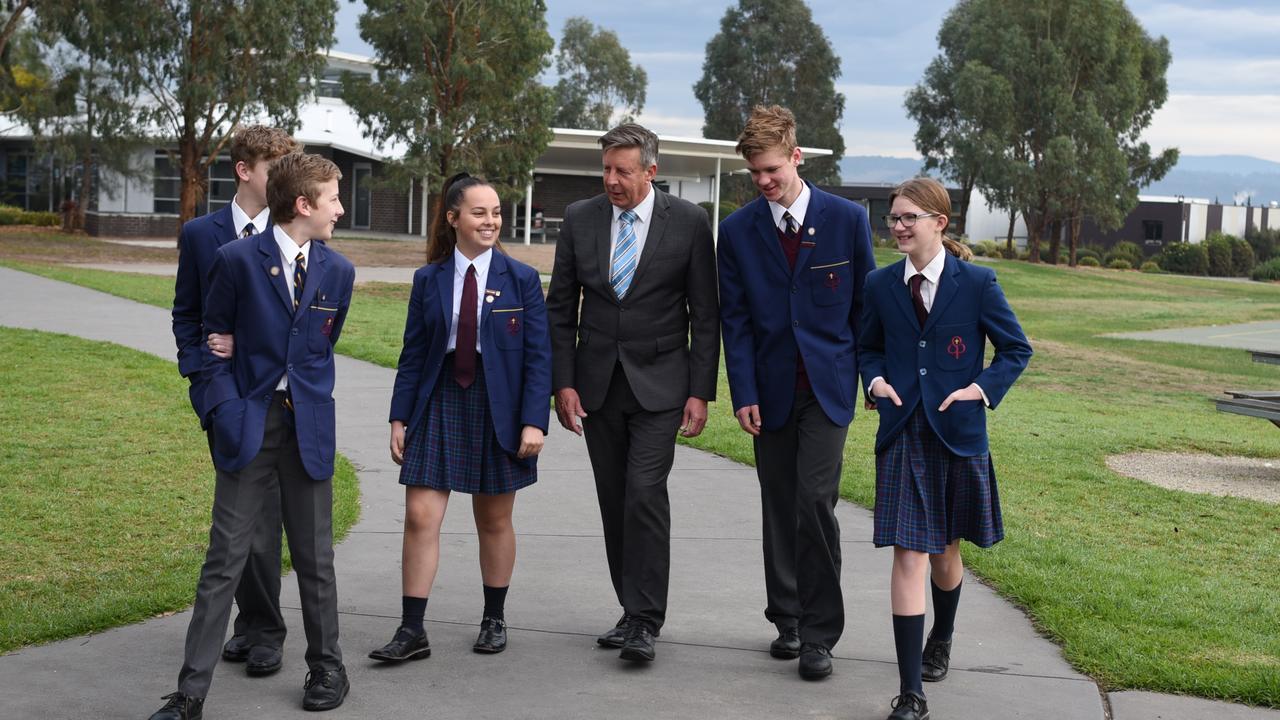 Students at St Paul's Anglican Grammar with principal Cameron Herbert.