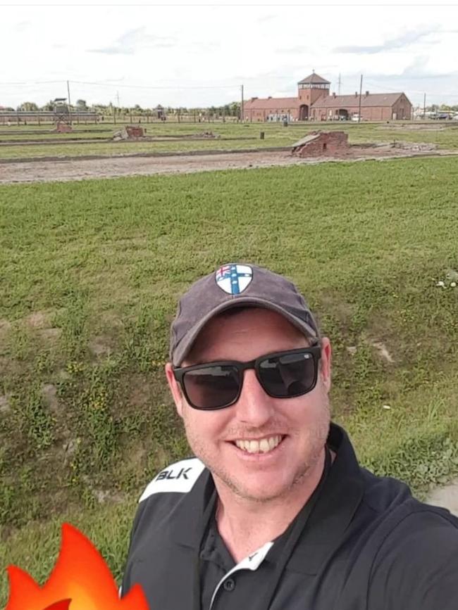 Tyler Baker-Pearce's smiling selfie outside Auschwitz. Picture: Twitter