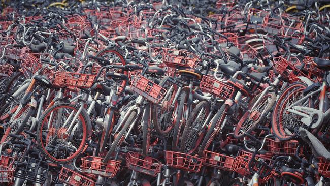 Bicycles of Chinese bike-sharing service Mobike are piled up in an abandoned brick factory in Wangzuo town, Fengtai district, Beijing, China, 6 June 2018. Picture: AFP