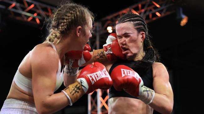 Boot (L), connects with a punch on Annie Thatcher last July. Picture: Getty Images