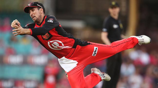 The Renegades’ Tom Cooper launches to catch the Sixers’ Moises Henriques on Wednesday night. Picture: Getty Images 