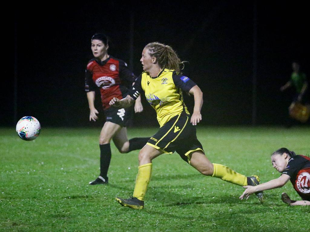 Tigers captain Siobhan Macken flies past the Lions defenders to secure the lose ball in the FNQ Football Premiership Women's match between the Edge Hill Tigers and the Lichhardt Lions, held at Tier Park, Manunda. Picture: Brendan Radke