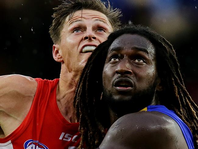 PERTH, WESTERN AUSTRALIA - MARCH 25: Callum Sinclair of the Swans contests a ruck with Nic Naitanui of the Eagles during the round one AFL match between the West Coast Eagles and the Sydney Swans at Optus Stadium on March 25, 2018 in Perth, Australia.  (Photo by Will Russell/AFL Media/Getty Images)