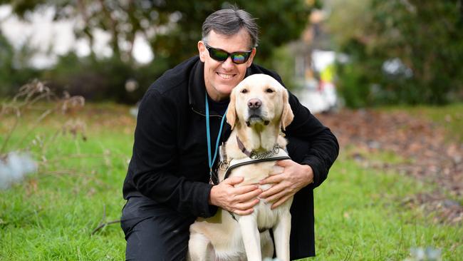 Simon and his guide dog Khan are taking part in Dialogue in the Dark. Picture: Lawrence Pinder