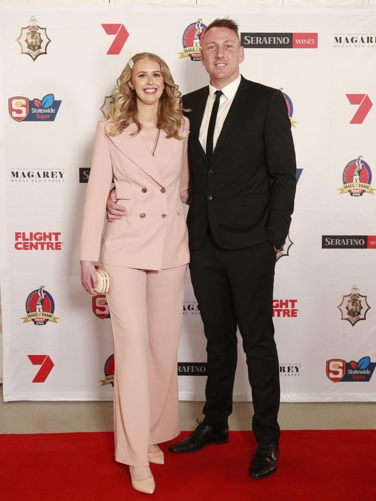 Amy Pawlowski wearing Georgy Collection and Sam Bauldeestone pose for a picture on the red carpet at Adelaide Oval in North Adelaide,for the Magarey Medal, Monday, September 9, 2019. Picture: Matt Loxton