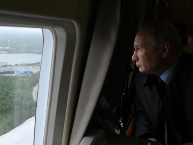 Russian President Vladimir Putin is flown by helicopter for a visit to an industrial centre in Belokamenka, Murmansk. Picture: Alexander Kazakov / Sputnik / AFP