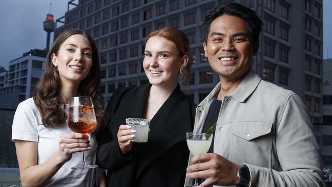 Deanna Lusk, 27, Inaia Soleil, 18 and Apollo Cabangca, 35. enjoy Sydney’s newest rooftop bar: The Strand Hotel on William Street. Picture: David Swift