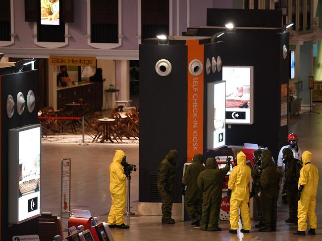 Decontamination operations at the departures terminal of the Kuala Lumpur International Airport. Picture: AFP