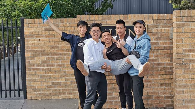 St Albans Secondary College dux Aaron Tran-Hoang celebrates with mates Bao Tran, Jason Nguyen, James Mangali, Minh Lai.