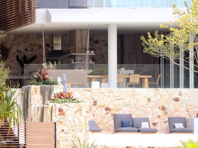 Alfresco dining, outdoor spaces and glass walls take advantage of the water views.