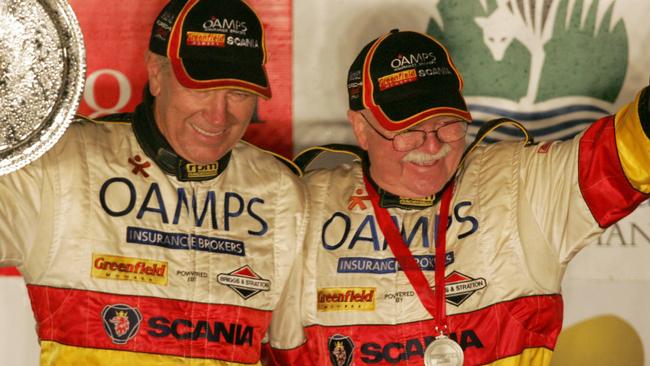 Targa Tasmania 2006, winners Jim Richards, left, and Barry Oliver celebrate with trophies and spraying champagne