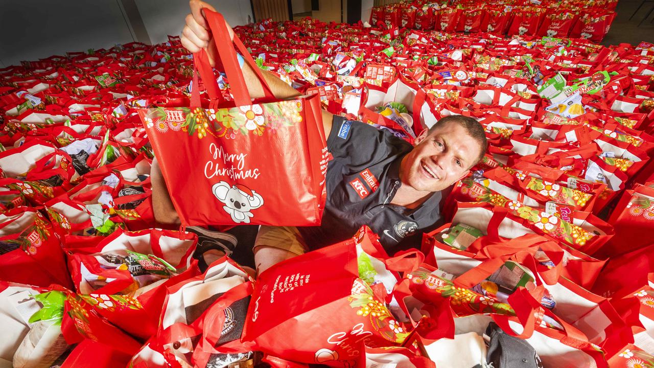 Collingwood FC midfielder and vice-captain Taylor Adams among Coles Christmas hampers and presents for a traditional Christmas Day luncheon for Melburnians in need. Picture: Rob Leeson