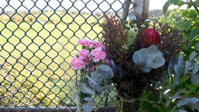 Flowers are placed near the beach access at Little Bay. Picture: NCA NewsWire / Jeremy Piper