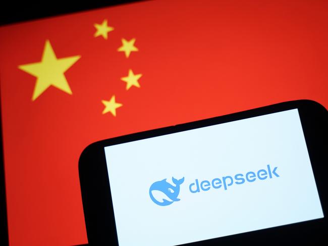 HONG KONG, CHINA - JANUARY 28: In this photo illustration, the DeepSeek logo is seen on a phone in front of a flag of China on January 28, 2025 in Hong Kong, China. Global tech stocks have plummeted following the emergence of DeepSeek, a Chinese AI startup that has developed a competitive AI model at a fraction of the cost of its US rivals, sparking concerns about the high valuations of tech giants like Nvidia. This development has led to significant declines in tech shares across Asia and Europe, with markets in both regions experiencing notable losses as investors reassess the AI landscape and its potential impact on the industry's future. (Photo illustration by Anthony Kwan/Getty Images)