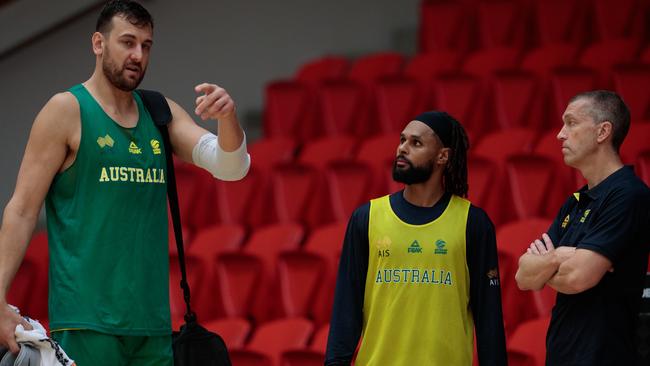 Andrew Bogut, Patty Mills and outgoing head coach of the Boomers Andrej Lemanis. Picture: AAP Image/Richard Wainwright