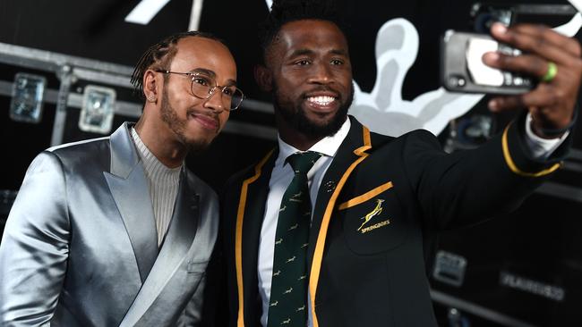 Laureus World Sportsman of the Year winner Lewis Hamilton with Laureus World Team of the Year winner Siya Kolisi, captain of the Springboks