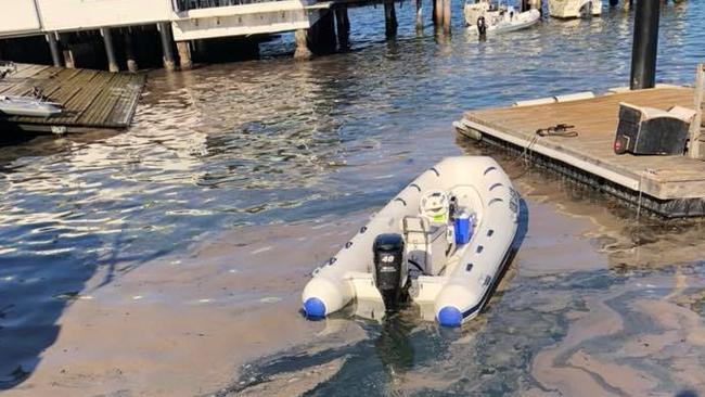 A smelly algal bloom collects near the shore between the Manly Yacht Club and the 16 Ft Skiff Club in Manly Cove. Credit: Andrew Dolly Divola/Facebook