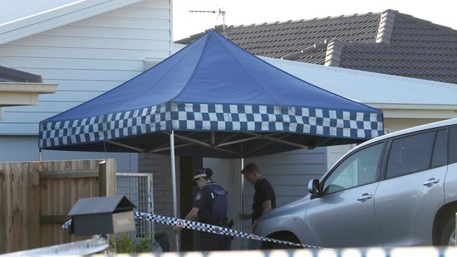 Police officers at a suburban Gold Coast crime scene.