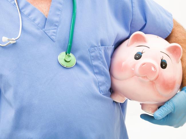 The cost of healthcare. Generic doctor piggy bank money photo.