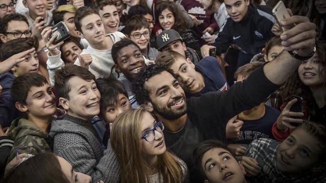 Liverpool soccer star Mohamed Salah proves a hit with kids during a visit to Italy. Now children in his native Egypt will study the secrets of his success. Picture: Instagram