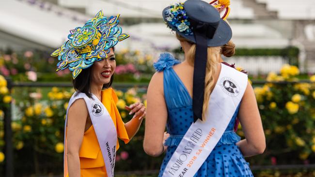 Colourful fashion contrasts with drab skies. Picture: Jason Edwards