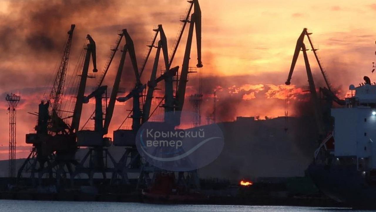 Smoke rising above a damaged warship following a Ukrainian attack in the port of Feodosiya, Russian-controlled Crimea. (Photo by Handout / Telegram / @VentdeCrimee / AFP)