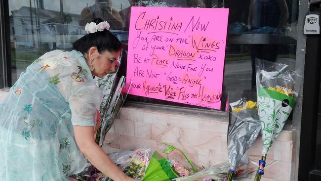 Christine Demas lays flowers at the Plaza Live on June 11, 2016 in Orlando, Florida. Christina Grimmie passed away following a shooting after her Orlando Concert.