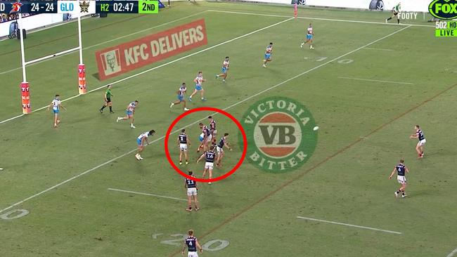 The Roosters form a wall as Sam Walker kicks a field goal to sink the Titans.